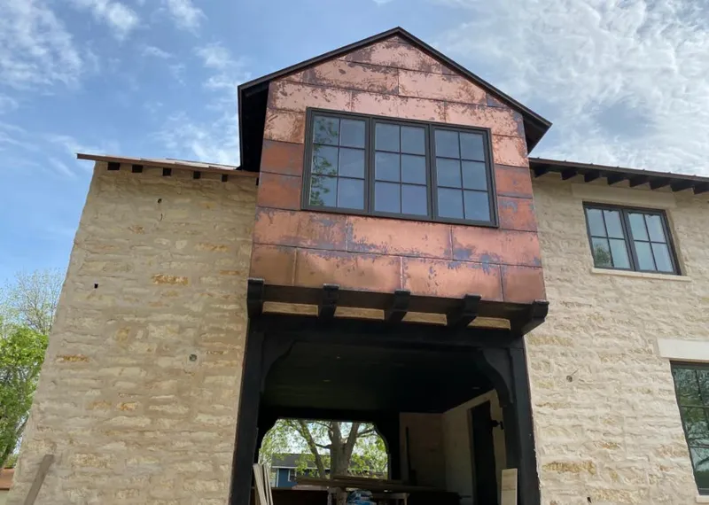 Copper metal panel facade on a stone building for Metal Roof Coating in Cloverleaf